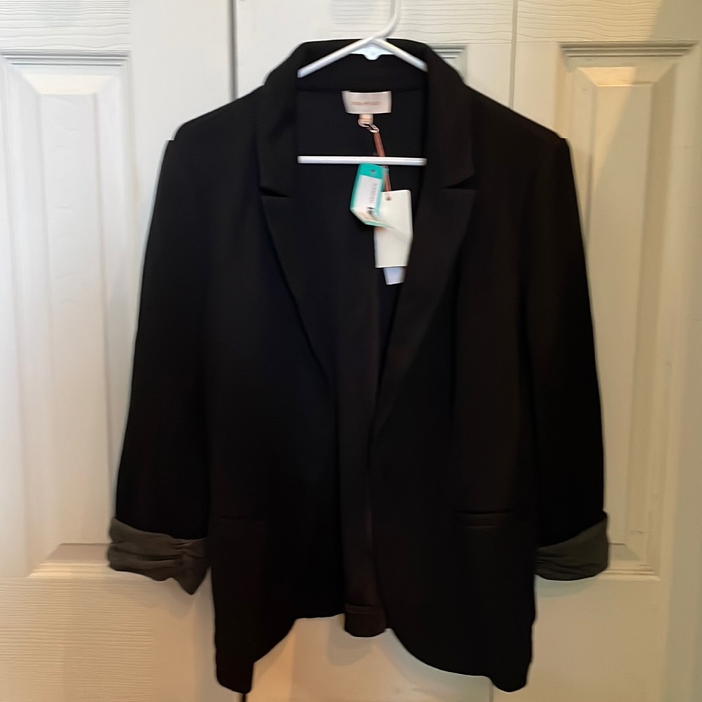 Black blazer with gray sleeve detail; Skies are Blue by StitchFix